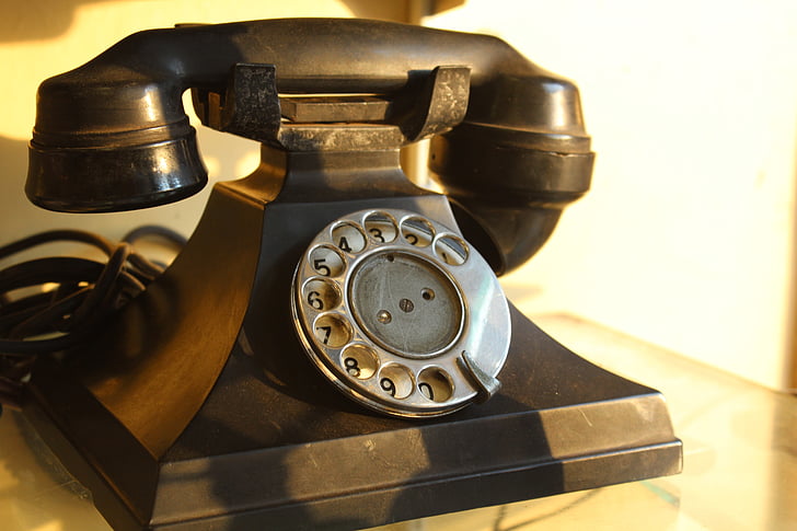 Photograph of a black rotary telephone